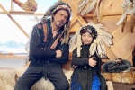 Shah Rukh Khan trolls, shah rukh khan age, shah rukh khan and his son abram trolled for sporting native american war bonnets, Abram Shah Rukh Khan trolls, shah rukh khan age, shah rukh khan and his son abram trolled for sporting native american war bonnets, Abram
